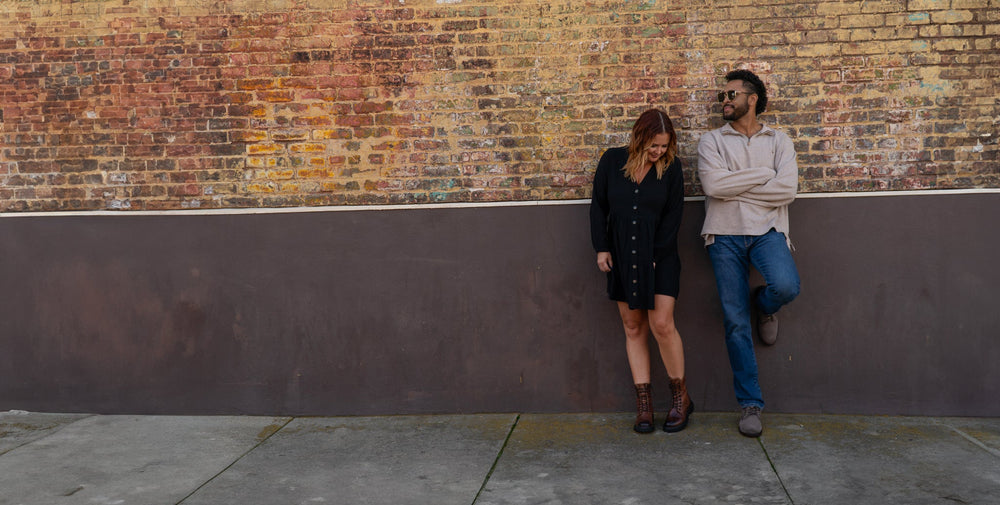 Two people standing next to each other in chelsea boots.