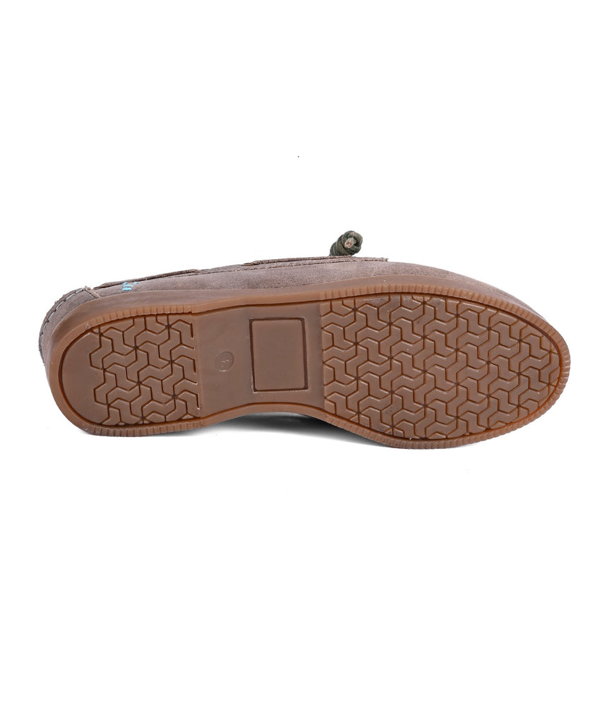 
                  
                    Bottom view of Roan's Abide women's leather boat shoe, featuring a textured rubber sole with a geometric pattern, a durable runner composite outsole, and a small rectangular label near the heel.
                  
                