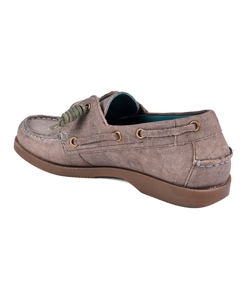 
                  
                    A single Roan Abide women's leather boat shoe in taupe suede with green laces and eyelets, a brown rubber sole, water-repellent features, and viewed from the rear.
                  
                