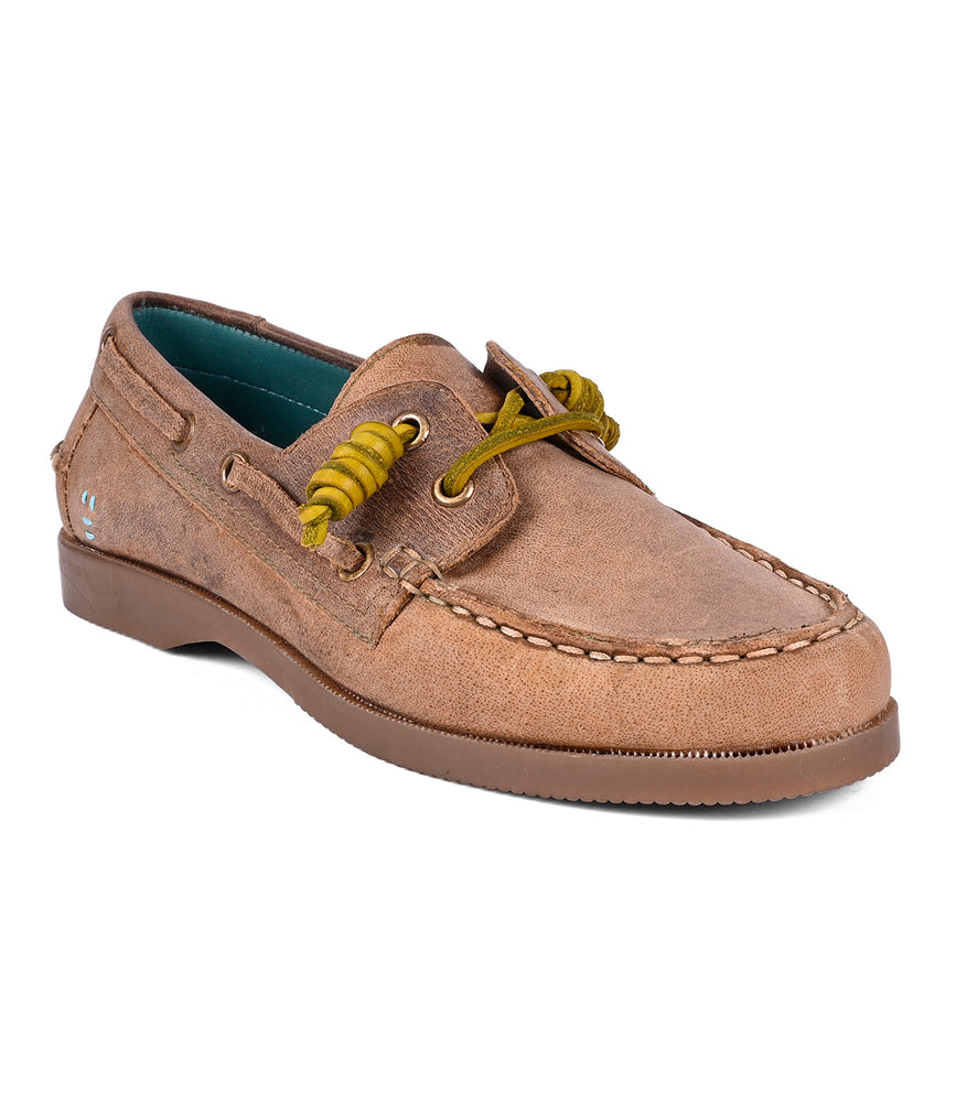 
                  
                    The Roan Abide women's leather boat shoe is crafted from brown leather with yellow laces, featuring stitching details and a durable runner composite outsole for added stability.
                  
                