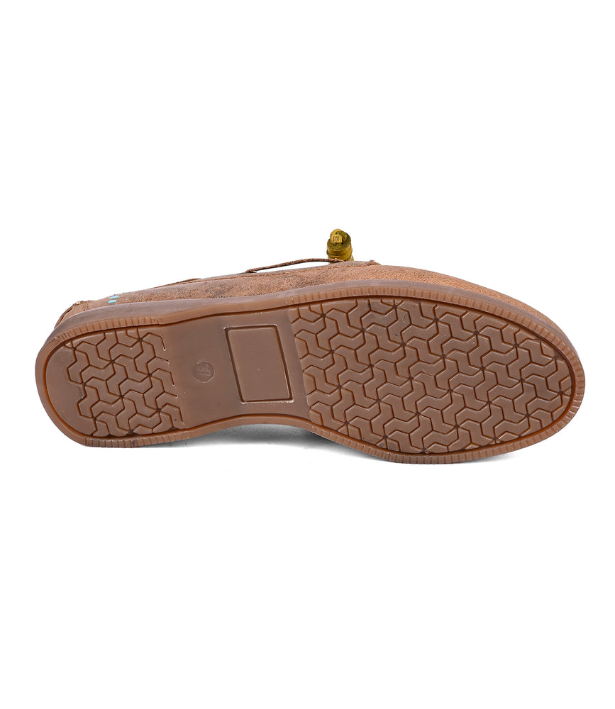 
                  
                    The underside of the Roan Abide brown women's leather boat shoe features a textured, durable runner composite outsole with water repellency and a small circular sticker near the heel.
                  
                