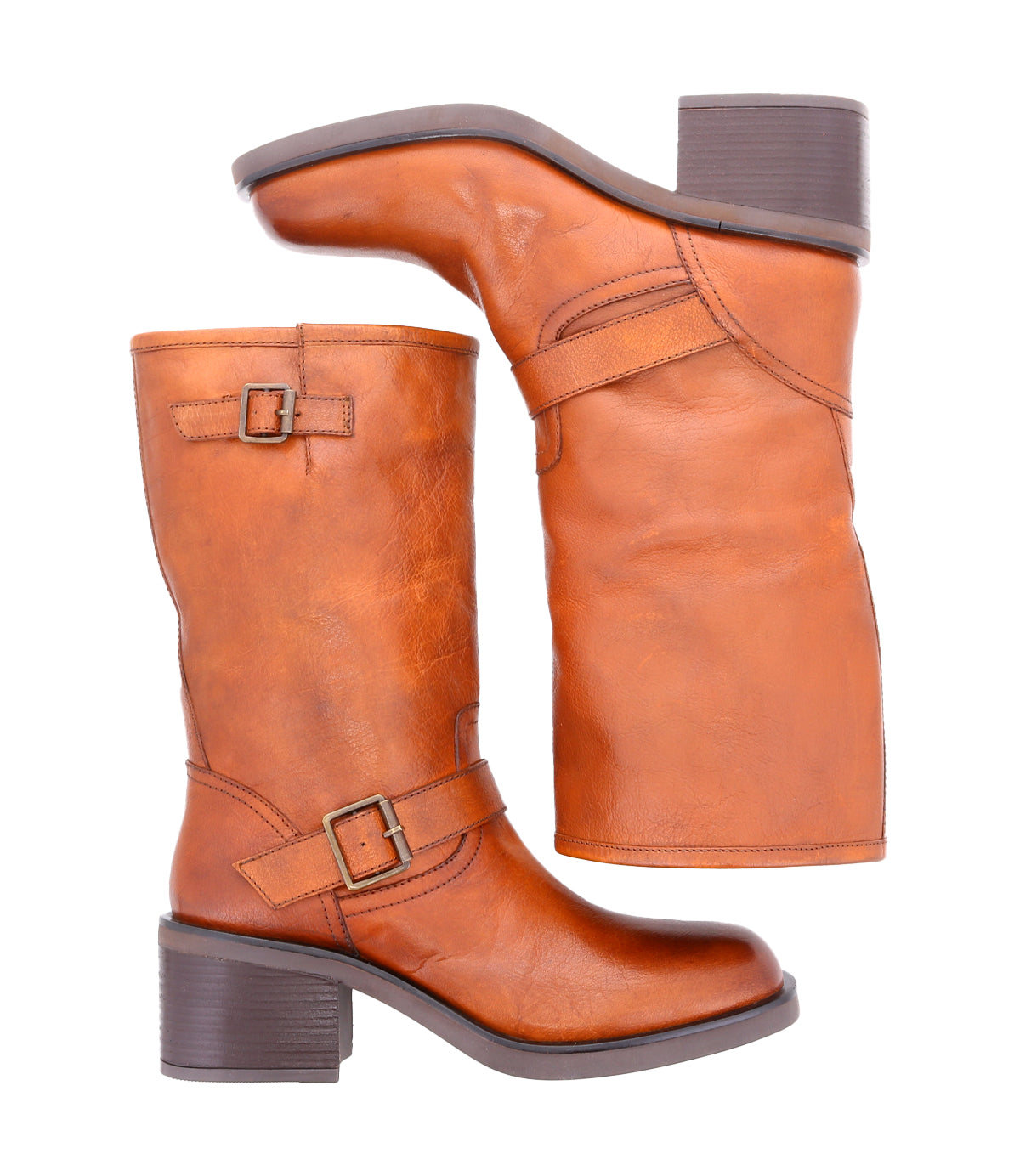 
                  
                    Women's mid-height brown leather boots with side buckles, laid side by side
                  
                