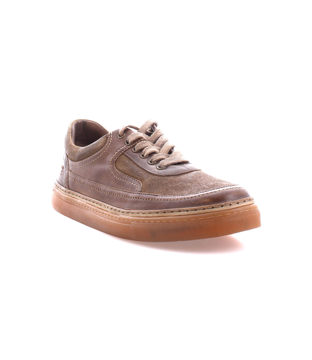 
                  
                    The "Eminent" by Roan is a brown casual lace-up sneaker with a suede and top-grain leather upper, complemented by a thick rubber sole, displayed on a white background.
                  
                