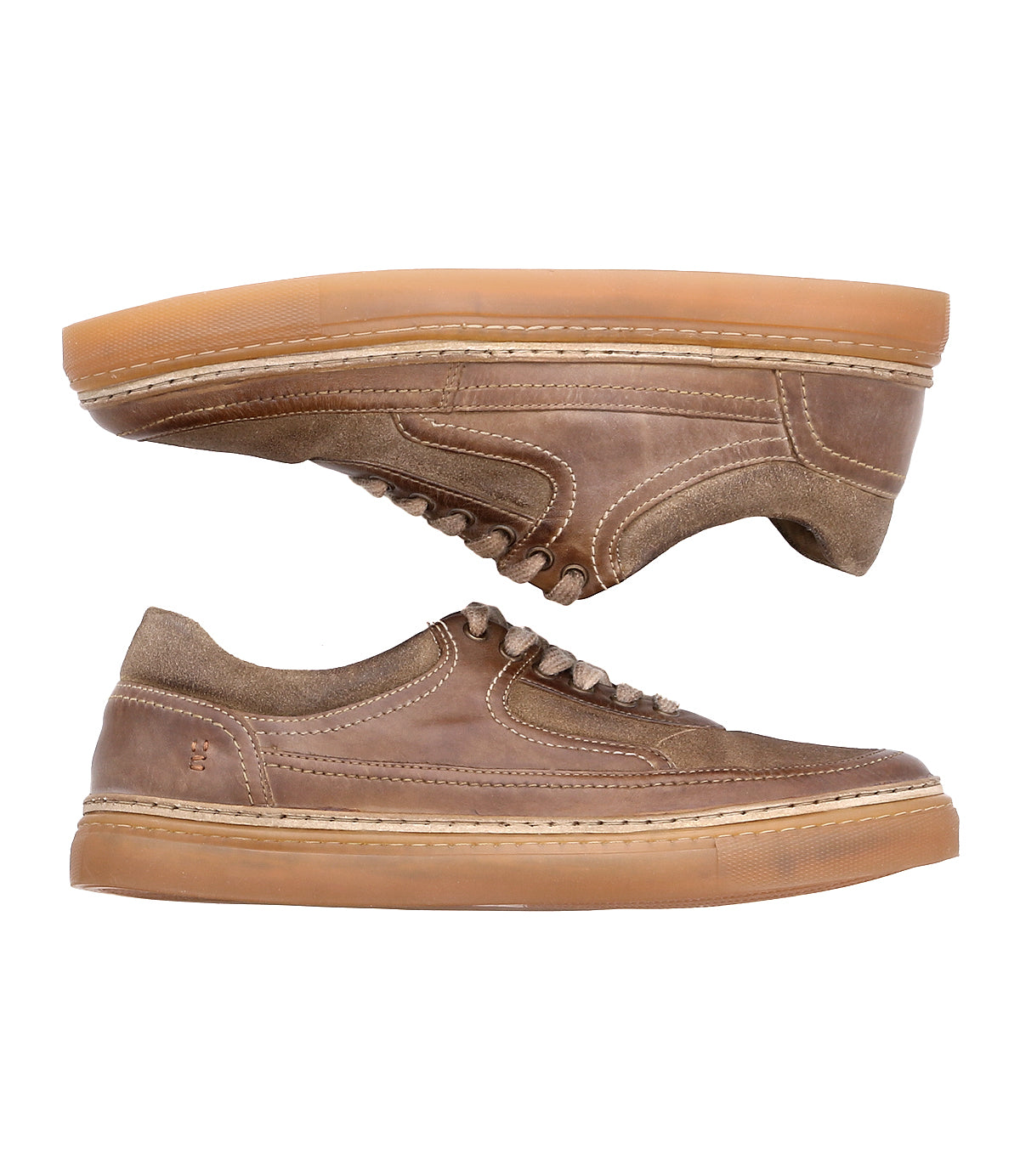 
                  
                    The Eminent sneaker by Roan is a brown leather lace-up featuring gum soles and stitching details, crafted from top-grain leather.
                  
                