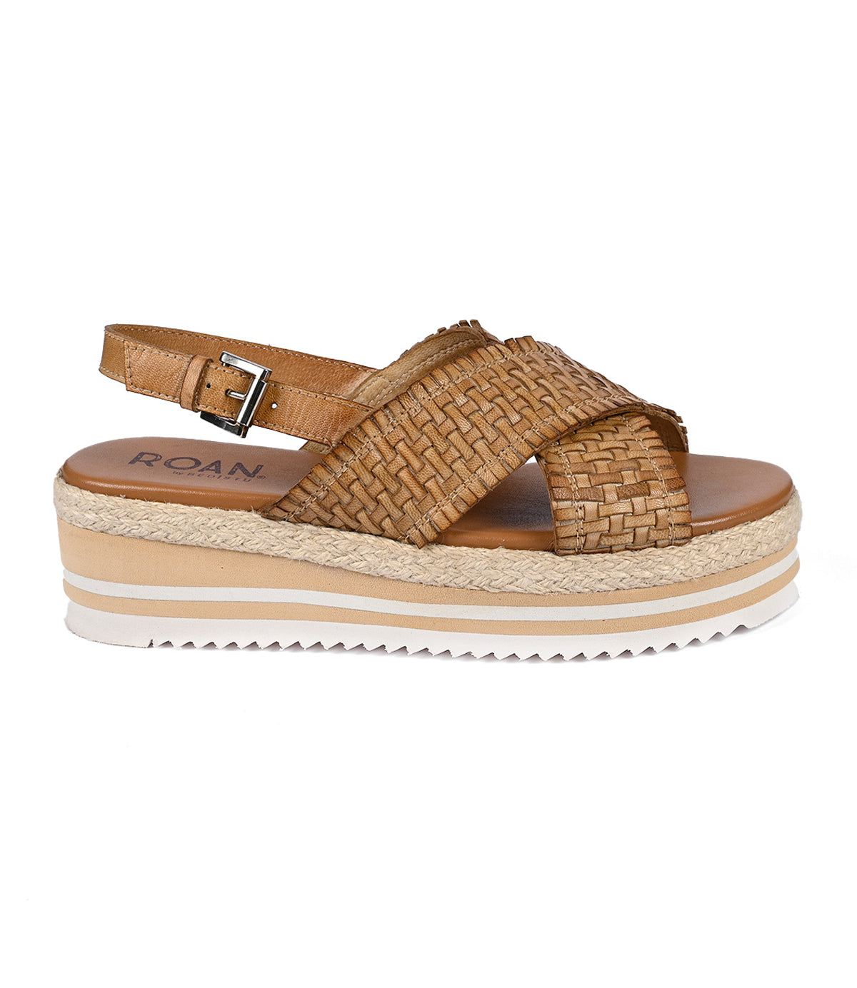 
                  
                    The "Into" by Roan is a brown woven platform sandal showcasing artisanal craftsmanship with an ankle strap and a lightweight serrated foam outsole.
                  
                