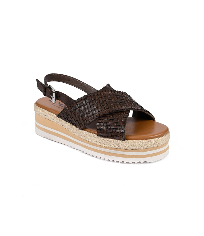 
                  
                    The Into by Roan is a brown woven leather platform sandal with artisanal craftsmanship, featuring an adjustable ankle strap, a crisscross front, and a thick tan and white sole with a lightweight serrated foam outsole for comfort.
                  
                