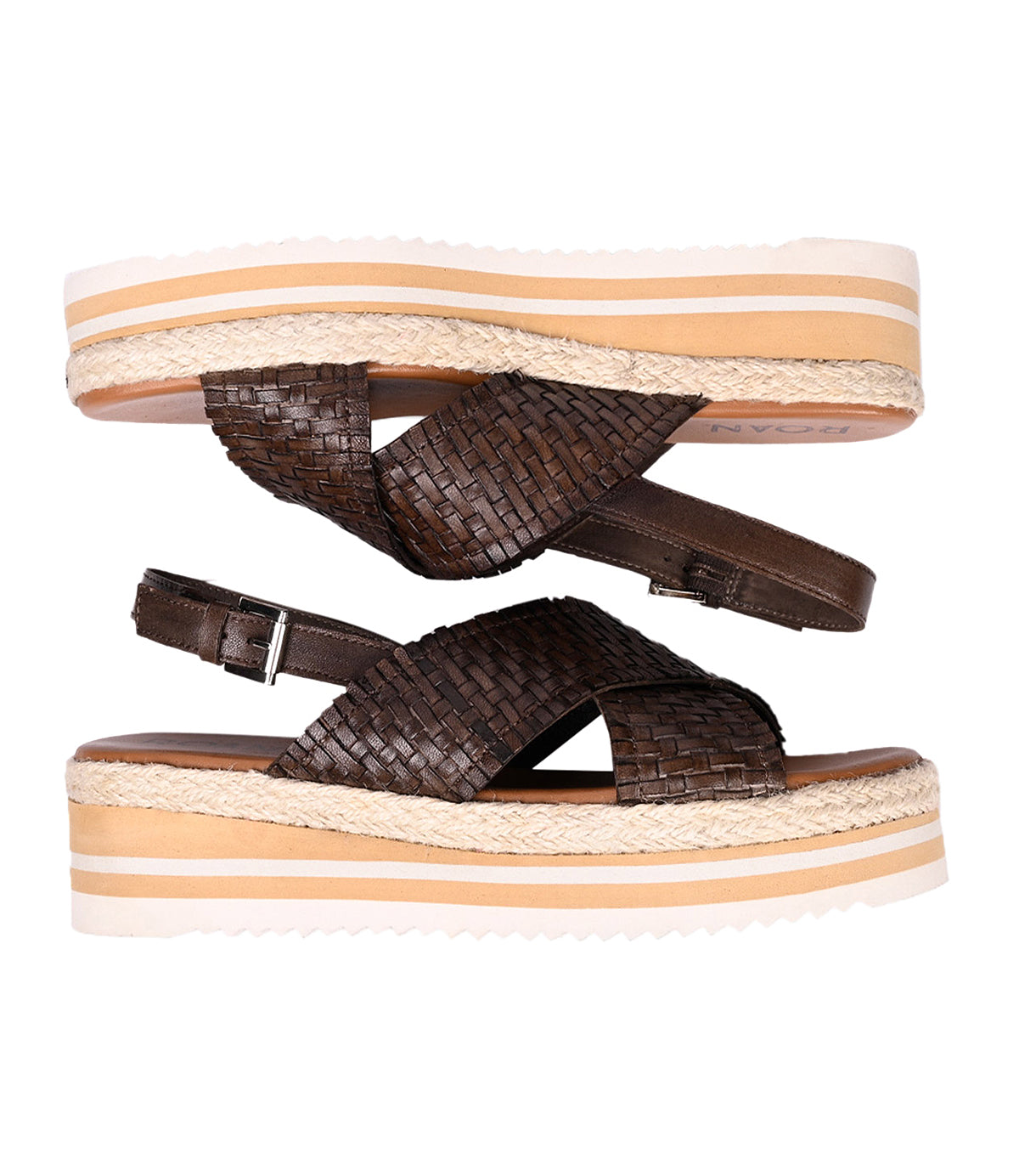 
                  
                    Two Into sandals by Roan, featuring brown woven leather and platform soles, stacked sole to sole, showcasing artisanal craftsmanship.
                  
                