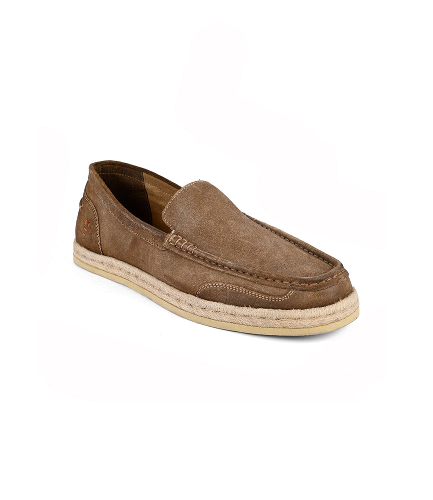 The Kaboom by Roan is a smart-casual brown suede slip-on loafer with premium suede, visible stitching, and a beige sole, showcased on a plain white background.