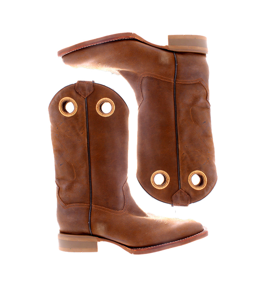 
                  
                    The Roan Satire brown leather cowboy boots boast a rugged style and decorative holes near the top, displayed side by side against a white background.
                  
                