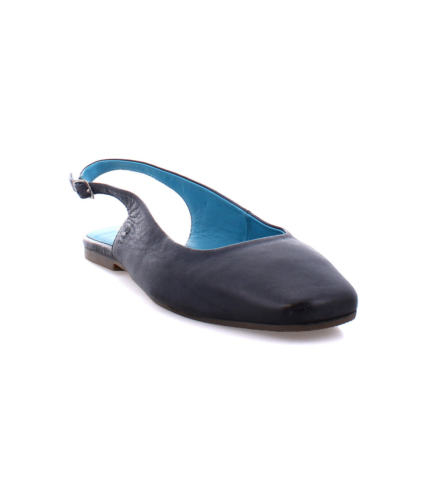 The Woken by Roan is a versatile black slingback flat featuring a leather upper, square toe, and striking blue inner lining.