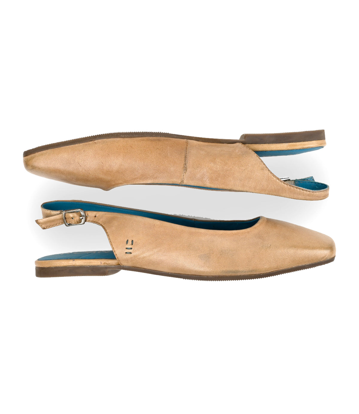 
                  
                    The Roan Woken slingback shoes feature a low heel, versatile tan leather upper, and a blue inner lining, displayed side by side.
                  
                