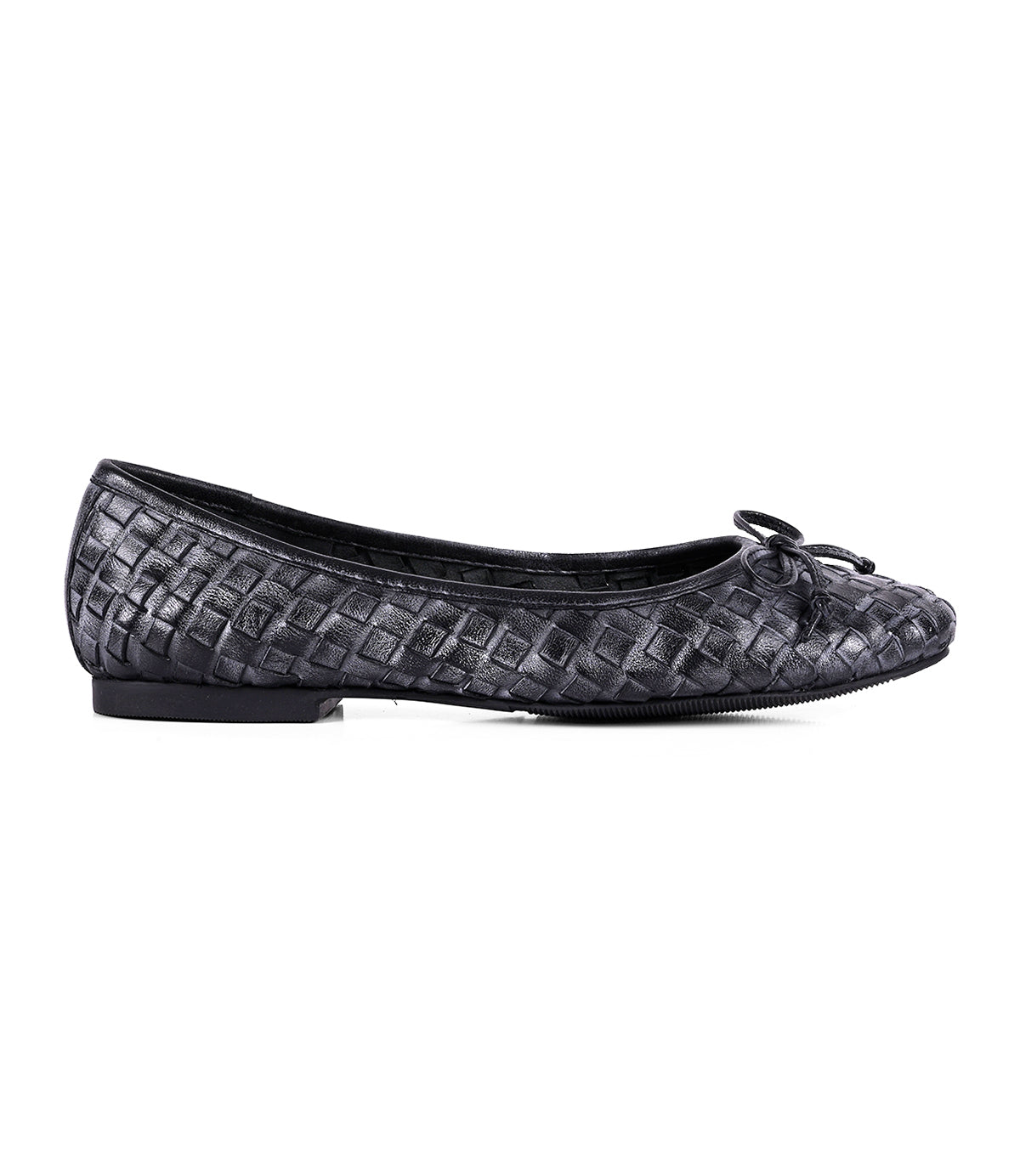 
                  
                    A single black flat slip-on ballerina shoe from Roan's "Business" collection, featuring a woven texture and a small bow on the toe, viewed from the side to highlight its intentional craftsmanship.
                  
                