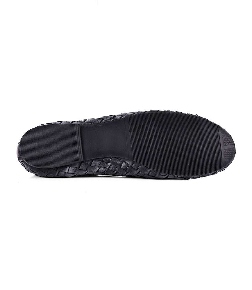 
                  
                    The image displays the bottom view of a black shoe sole from Roan's "Business" collection, highlighting a blend of textured and smooth surfaces for optimal grip and durability, exemplifying the meticulous craftsmanship in our slip-on ballerina shoes.
                  
                