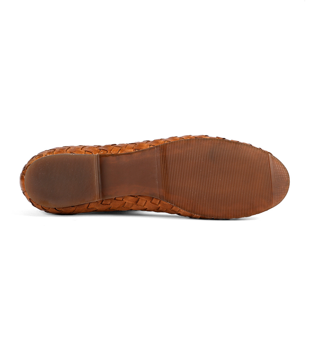 
                  
                    Bottom view of a brown Roan Business shoe sole featuring a textured tread pattern with a central smooth section, showcasing the intentional craftsmanship reminiscent of hand-woven leather designs.
                  
                