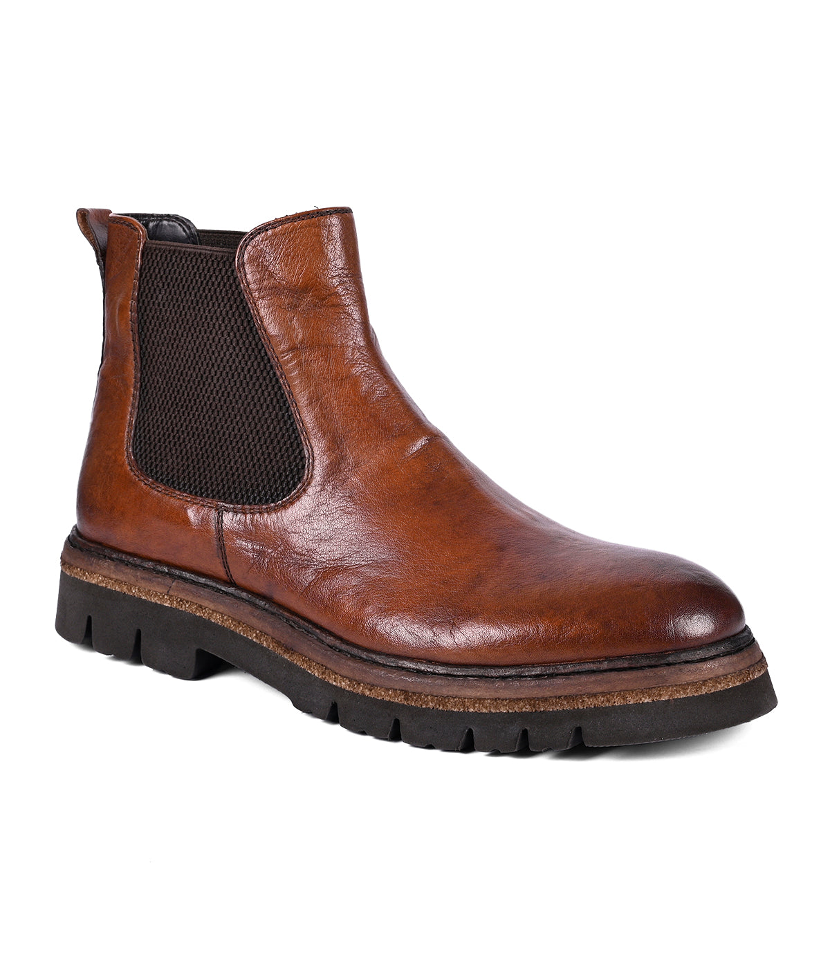 
                  
                    The Defy boot by Roan is a hand-finished brown leather Chelsea boot, designed with black elastic side panels and equipped with a traction-friendly rubber sole for enhanced stability.
                  
                