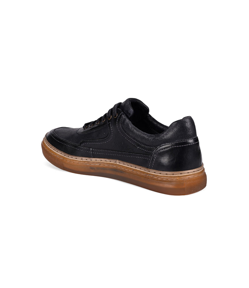 
                  
                    The Eminent lace-up sneaker by Roan is crafted with top-grain leather, featuring a black upper and brown rubber sole, elegantly viewed from the back.
                  
                