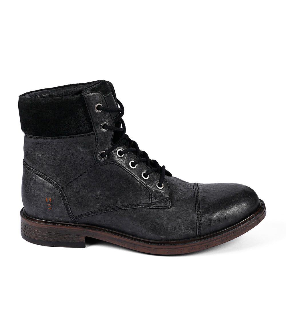 The Roan Lecture is a black men's full-grain leather lace-up boot with a dark wooden sole and rounded cap-toe, featuring a padded collar and stitch details.